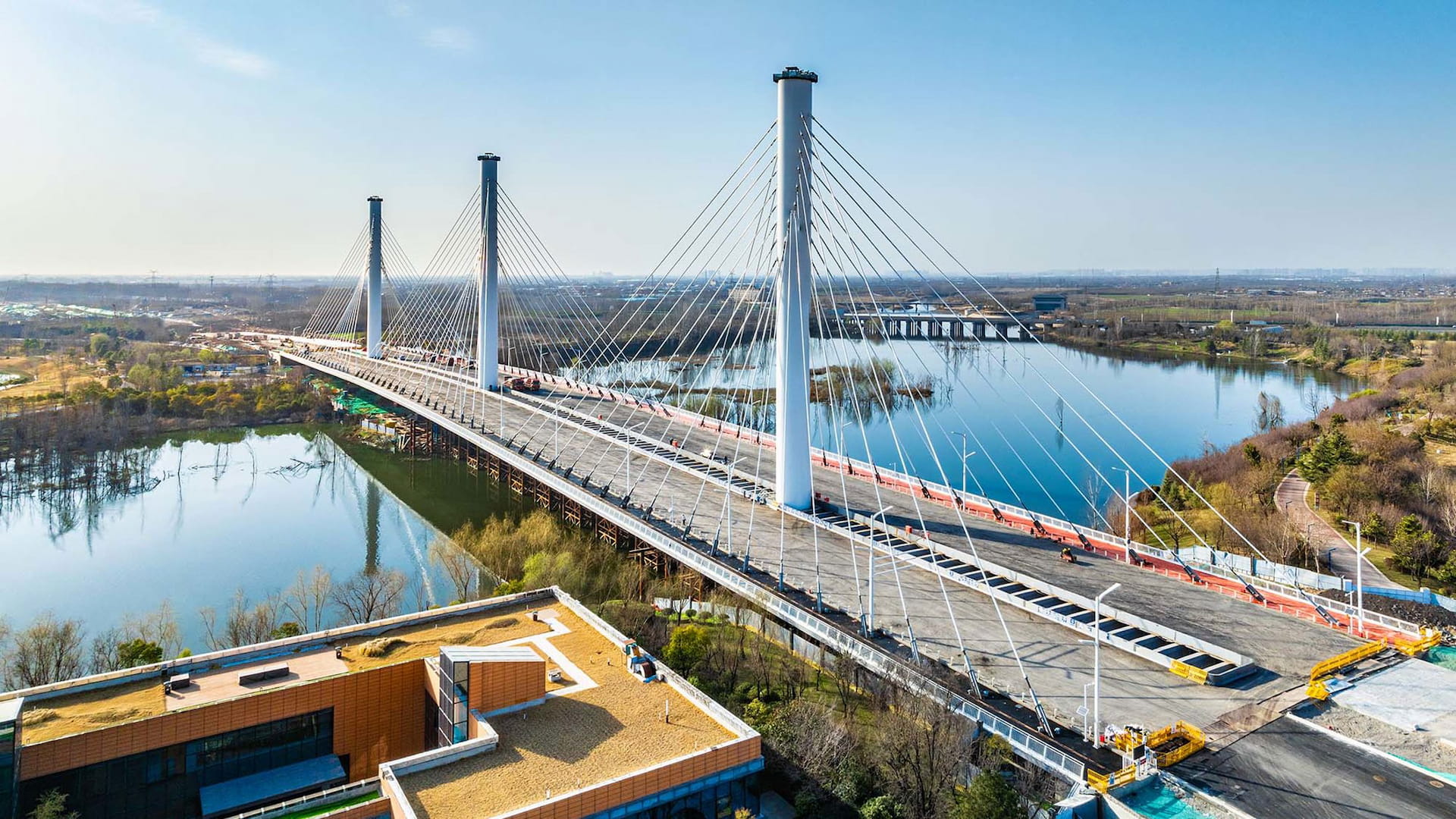 Bridge construction with cranes and steel reinforcement