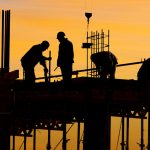 A group of men working on a construction site.