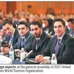 Here's a concise alt tag for the image: `Foreign experts at UNWTO General Assembly, 2017`