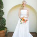 Bride in white gown with bouquet.